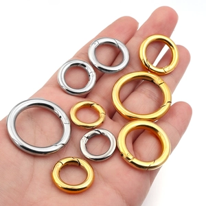 Macro shot of gold and silver stainless steel spring ring clasps in various sizes