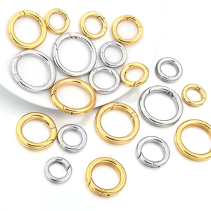 Polished gold and silver spring ring snap hooks in various sizes for DIY jewelry making