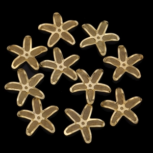 Detailed macro view of star-shaped copper wire mesh jewelry components in gold plating