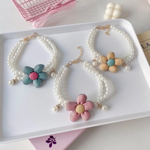 Dual-layer pearl pet necklace with fabric flowers in pink, blue, and yellow colors