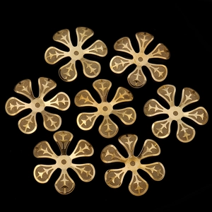 Macro detail of gold-plated copper wire flower petals with mesh texture for DIY jewelry