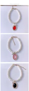 Three elegant pearl pet necklaces with red pink and black oval gemstone pendants detail