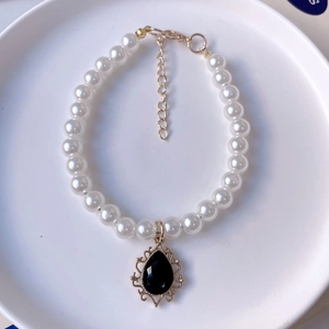Elegant pearl pet necklace with vintage black gemstone pendant and gold lace setting