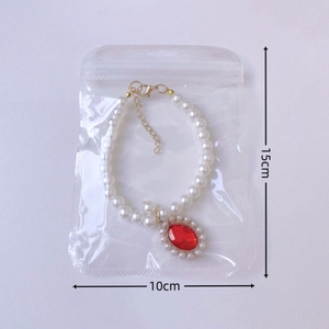 Exquisito collar de perlas para mascotas con colgante de gema roja y cadena dorada