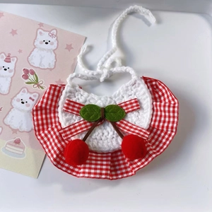 Handmade knitted pet bib with red cherry pom-poms and checkered ruffle trim decoration