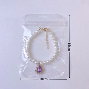 Faux pearl pet necklace with purple teardrop gemstone and adjustable golden chain