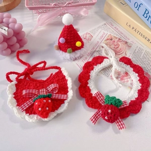 Detailed view of handmade strawberry crochet pet collar set and mini knitted hat