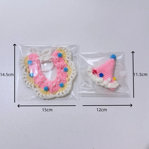 Handmade pink crochet pet party hat and lace collar set with colorful pom-poms