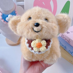 Detail of a plush dog toy wearing a handmade crochet flower collar with white petals