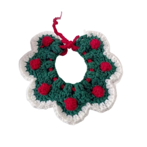 Handmade crochet Christmas pet collar with festive green waves and red pompom decorations