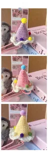 Detailed display of handmade pet knit birthday hats in purple, pink, and yellow colors