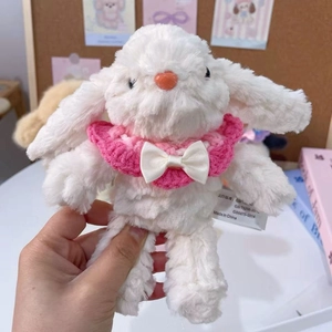 White plush bunny doll featuring a pink knitted scarf with a bow and detailed soft texture
