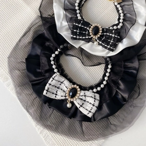 Detail view of pet pearl collar with tweed bow and lace trim for cats and small dogs