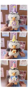 Three plush penguins with knit hats and flower bibs in pastel macaron colors