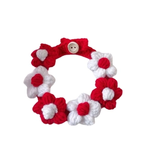 Handmade crochet pet collar with red and white puff flowers and a wooden button
