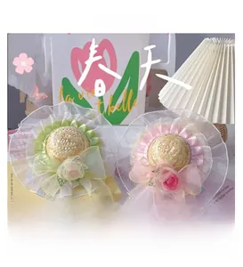 Detail of pet straw hats with lace ruffles and silk rose flowers for cats and dogs