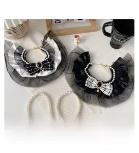 Detailed set of elegant pet collars with lace lace, pearls, and tweed bow accents