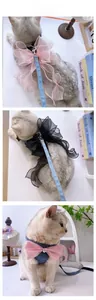 Detail of pink and black cat harness with denim fabric and large organza bow decoration