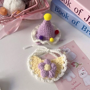 Handmade crochet pet hat and bib set with purple pompoms and floral detail for dolls