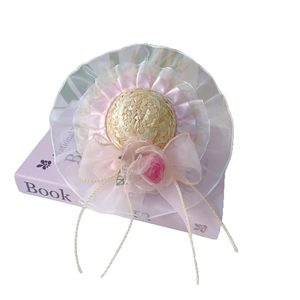Mini pet straw hat featuring pink lace, organza bow, and rose for cats and dogs