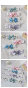 Detailed set of lace pet collars with silk bows and pearl charms in four pastel colors