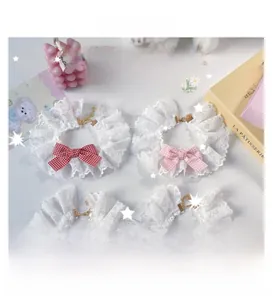 Detail of adjustable pet lace collars with gingham bows in four vibrant colors