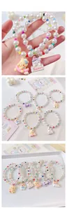 Detail showing colorful beaded pet necklaces with cartoon resin animal pendants and pearls