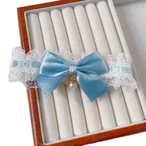 Light blue pet collar with lace detailing, satin bow and pearl charm in a velvet box