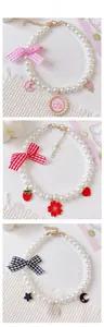 Three styles of pearl pet collars with ribbon bows and floral enamel charms detail