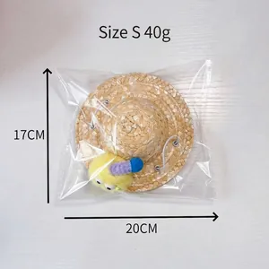 Size S pet straw sun hat for cats and small dogs featuring colorful plush ball accents
