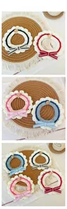 Detail of hand-crocheted pet lace collars with bowknots and wooden buttons for cats