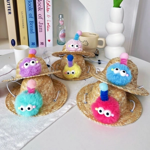 Set of six colorful pet straw hats with fuzzy pom-poms and adjustable straps