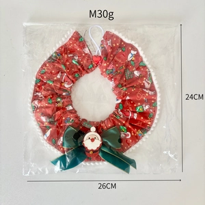 Christmas pet bandana with green bow and Santa Claus print for dogs and cats