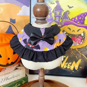 Detail of Halloween pet collar with purple bat print and black decorative bow tie