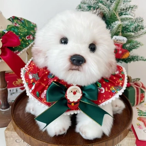 Christmas dog collar with large green bow and Santa Claus plush on a white puppy