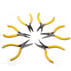 Overhead view of six mini DIY pliers with yellow non-slip handles and polished steel heads