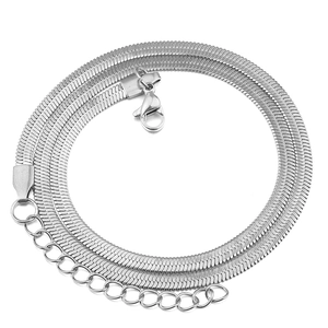 Detailed macro view of flat silver snake chain with lobster clasp and extension link