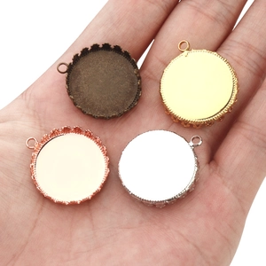 Macro shot of crown bezel pendant trays in bronze, gold, rose gold and silver finishes