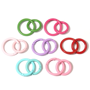 Close-up of colorful round spring gate rings in various sizes for DIY bag accessories