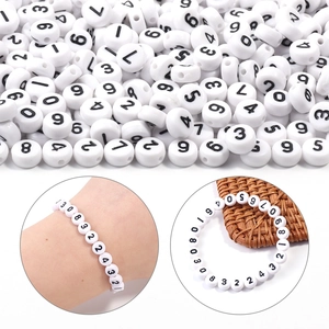 Macro shot of 7x4mm acrylic number beads and handmade bracelet DIY jewelry making accessories