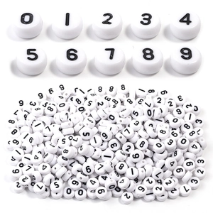 Detailed macro view of 7x4mm white acrylic number beads for DIY jewelry making