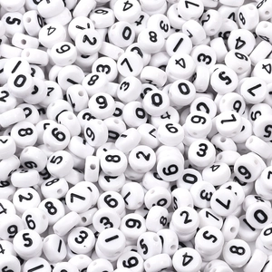 Macro shot of 7x4mm white acrylic number beads with black print for DIY jewelry crafts
