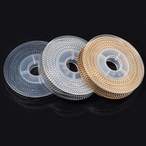 Three rolls of gold, silver, and black stainless steel bead chains for jewelry making