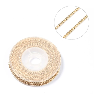 Macro detail of gold plated box chain roll for DIY jewelry making accessories