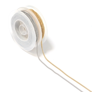 Detailed view of gold and silver plated 304 stainless steel chain on clear spools for DIY