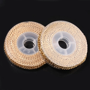 Macro view of gold-plated stainless steel Cuban NK chain rolls for DIY jewelry making