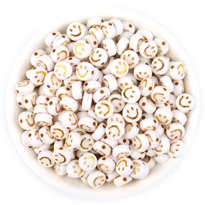 Flat round white acrylic beads with golden smiley face patterns for DIY bracelets