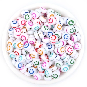 Flat round white acrylic beads with colorful smiley face patterns for DIY bracelets