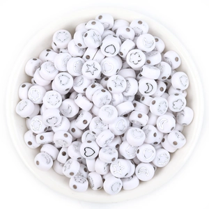 Flat round white acrylic beads with silver star, heart, and flower designs for DIY jewelry