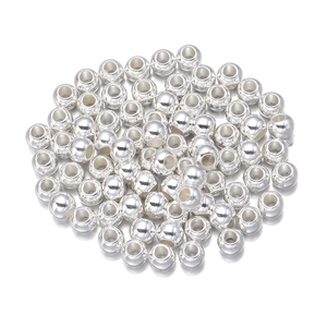 Macro detail of polished silver CCB beads with large holes for DIY jewelry making